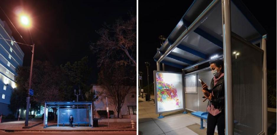 People waiting at lighted bus shelters