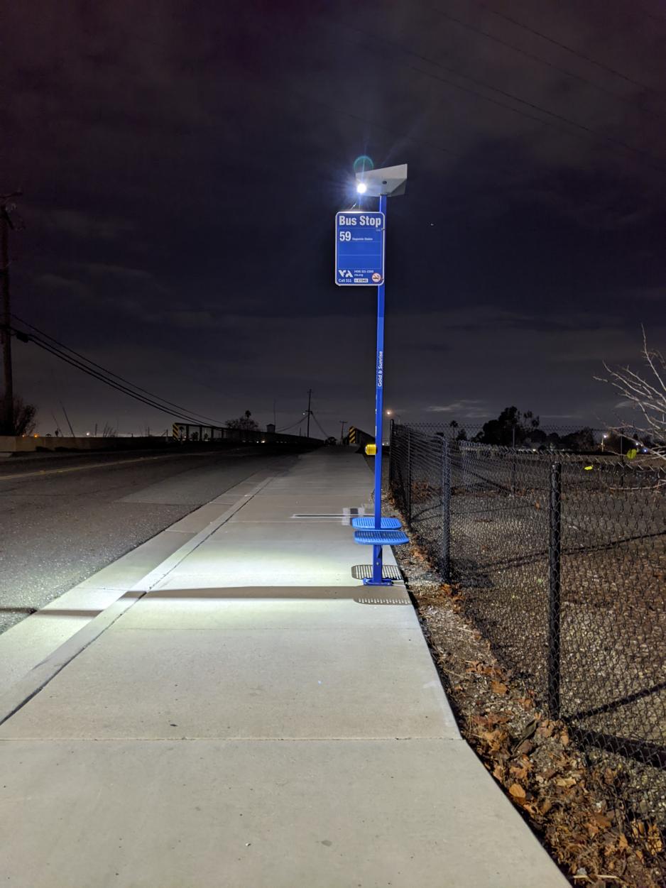 lighted bus stop at night