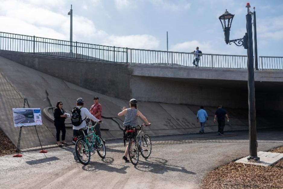 bicyclists riding through underpass